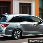 혼다 오디세이와 크라이슬러 퍼시피카 비교 - A sleek and classic Honda Odyssey minivan parked on a modern urban street during daytime, showcasing...