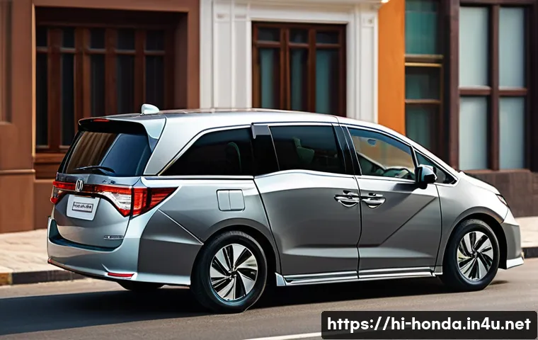 혼다 오디세이와 크라이슬러 퍼시피카 비교 - A sleek and classic Honda Odyssey minivan parked on a modern urban street during daytime, showcasing...